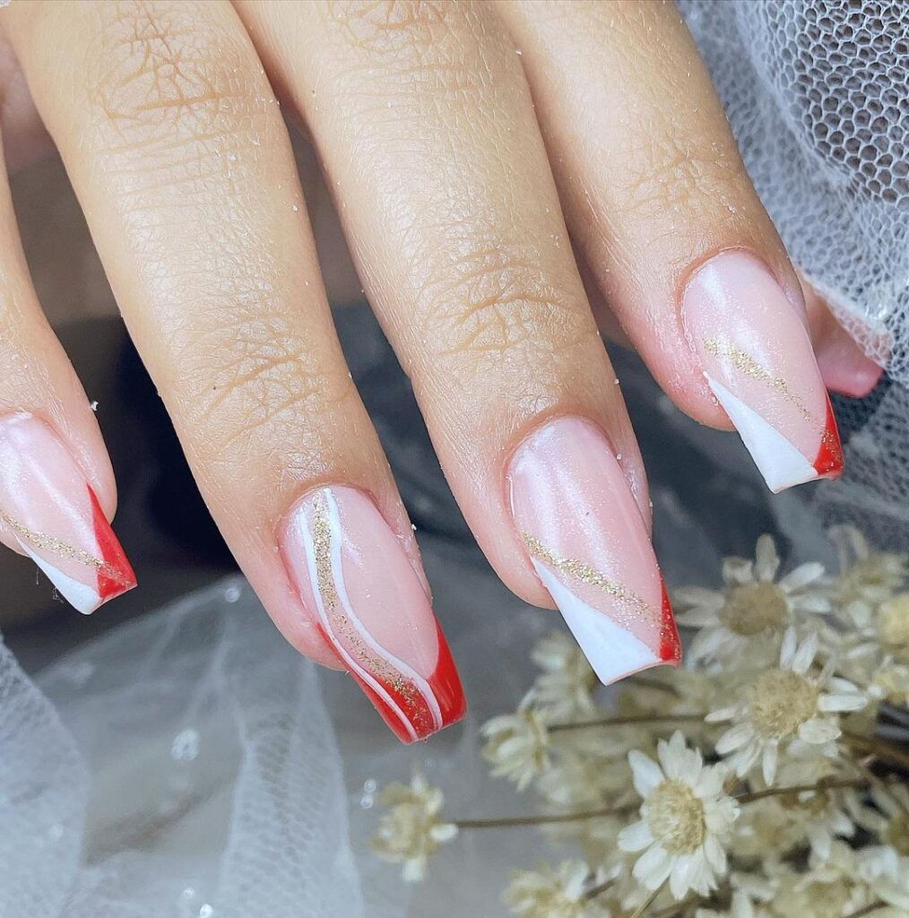 unhas vermelhas decoradas com branco